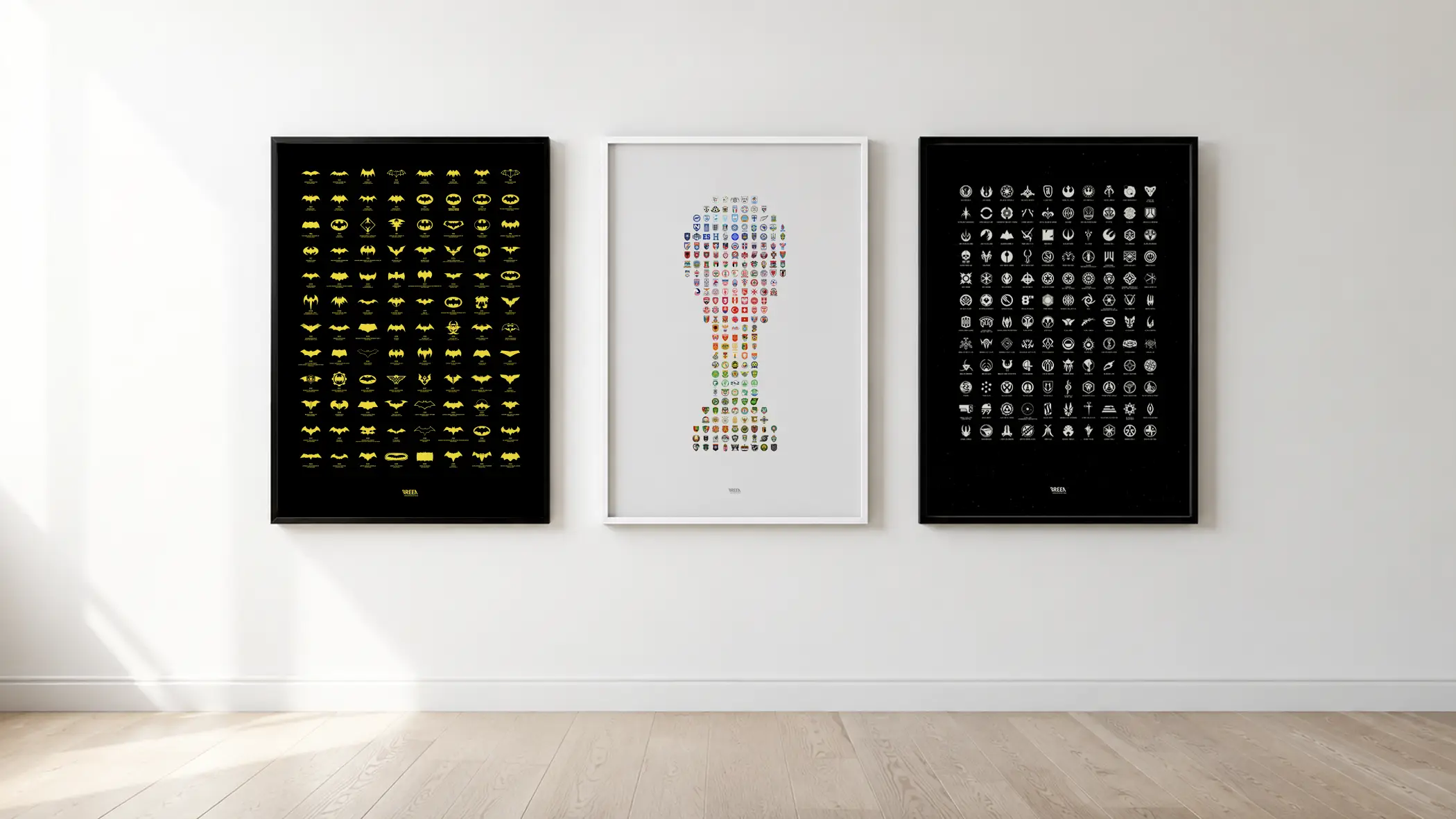 Three framed Breen posters side by side on a gallery wall